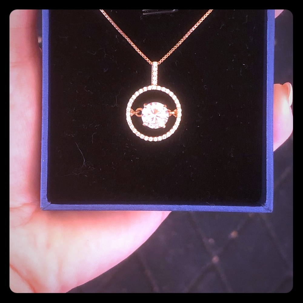 2.4 CW colorless Moissanite dancing pendant.